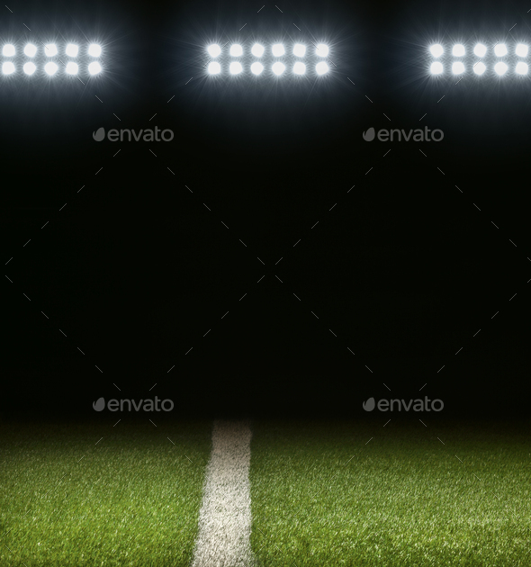 Grass Athletic Field With White Stripe And Dark Background Below